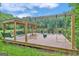 Relaxing dock with swings and seating overlooking a pond at 282 Quarters Rd, Fayetteville, GA 30215