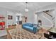 Game room with blue couch, and views into kitchen area at 282 Quarters Rd, Fayetteville, GA 30215