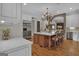 Modern kitchen with island, stainless steel appliances, and hardwood floors at 282 Quarters Rd, Fayetteville, GA 30215