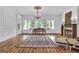 Elegant living room with hardwood floors, fireplace, and large windows at 282 Quarters Rd, Fayetteville, GA 30215