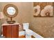 Charming powder room with unique sink and artistic wall decor at 282 Quarters Rd, Fayetteville, GA 30215