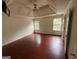 Spacious main bedroom featuring a trey ceiling, hardwood floors, and plenty of natural light at 3393 Madison Farm Way, Snellville, GA 30039