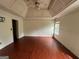 Spacious main bedroom featuring a trey ceiling, hardwood floors, and plenty of natural light at 3393 Madison Farm Way, Snellville, GA 30039