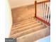 Carpeted staircase with white banister and wood railing leading to the upper level of the home at 362 Arbor Ridge Pkwy, Mcdonough, GA 30253