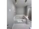 Bathroom features a large corner soaking tub and separate shower with white tile at 192 Wedgefield Dr, Mcdonough, GA 30252