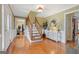 Bright foyer with hardwood floors, staircase, and decorative table at 961 Jimson Se Dr, Conyers, GA 30013