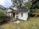 Exterior view of the home with a porch and modest landscaping at 3494 Thompson Dr, Atlanta, GA 30331