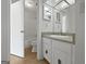 Full bathroom with a white vanity and toilet at 1084 Village Rd, Stone Mountain, GA 30088