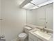 Bright bathroom featuring a marble countertop and large mirror at 1084 Village Rd, Stone Mountain, GA 30088