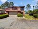 Charming townhome with a balcony, attached garage, and well-maintained landscaping in a residential community at 1084 Village Rd, Stone Mountain, GA 30088