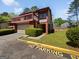 Charming townhome with a balcony, attached garage, and well-maintained landscaping in a residential community at 1084 Village Rd, Stone Mountain, GA 30088