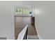 Open living room with fireplace and backyard views through expansive windows at 1084 Village Rd, Stone Mountain, GA 30088