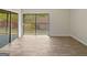 Living room with sliding glass doors that lead to outdoor deck at 1084 Village Rd, Stone Mountain, GA 30088