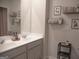 Modern bathroom with double vanity and wall decor at 1625 Zara Ln, Stockbridge, GA 30281