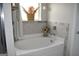 Relaxing bathroom with soaking tub and tile surround at 1625 Zara Ln, Stockbridge, GA 30281