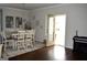 Dining room with table and chairs, hardwood floors and access to backyard at 1625 Zara Ln, Stockbridge, GA 30281