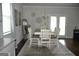 Bright dining area with table and chairs, hardwood floors and access to patio at 1625 Zara Ln, Stockbridge, GA 30281