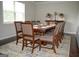 Formal dining room with large table and chairs, hardwood floors and large window at 1625 Zara Ln, Stockbridge, GA 30281