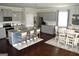 Open concept kitchen and dining area with gray cabinets and hardwood floors at 1625 Zara Ln, Stockbridge, GA 30281