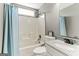 Clean bathroom with single vanity, shower/tub combo and light blue accents at 4248 Brighton Nw Way, Kennesaw, GA 30144