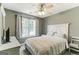 Bright bedroom with a queen-size bed and large window at 4248 Brighton Nw Way, Kennesaw, GA 30144