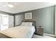 Guest bedroom with a queen-size bed and neutral decor at 4248 Brighton Nw Way, Kennesaw, GA 30144