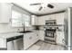 Kitchen with white cabinets, stainless steel appliances, and granite countertops at 4248 Brighton Nw Way, Kennesaw, GA 30144