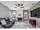 Living room with fireplace, gray walls, and leather furniture at 4248 Brighton Nw Way, Kennesaw, GA 30144