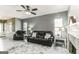 Spacious living room featuring a fireplace and comfortable leather seating at 4248 Brighton Nw Way, Kennesaw, GA 30144