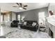 Living room with fireplace, gray walls, and leather furniture at 4248 Brighton Nw Way, Kennesaw, GA 30144