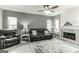 Living room with fireplace, gray walls, and leather furniture at 4248 Brighton Nw Way, Kennesaw, GA 30144