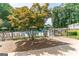 Community pool with lounge chairs and trees at 4248 Brighton Nw Way, Kennesaw, GA 30144