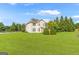 Expansive backyard with a lush green lawn, offering ample space and landscaping at 6510 Bentley Ridge Dr, Cumming, GA 30040