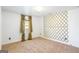 Empty bedroom with neutral carpet, a window with drapes, and geometric pattern on the wall at 6510 Bentley Ridge Dr, Cumming, GA 30040