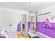 Vibrant bedroom with colorful accents, a comfortable bed, and plenty of natural light at 6510 Bentley Ridge Dr, Cumming, GA 30040