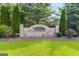 Stone entrance sign for Bentley Ridge community, surrounded by greenery at 6510 Bentley Ridge Dr, Cumming, GA 30040
