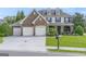 Beautiful two-story home with a three-car garage and well-kept lawn at 6510 Bentley Ridge Dr, Cumming, GA 30040