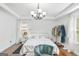 Bright and airy bedroom featuring hardwood floors, white furniture, and elegant window treatments at 6510 Bentley Ridge Dr, Cumming, GA 30040