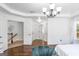 Bright and airy bedroom featuring hardwood floors, white furniture, doors and hallway at 6510 Bentley Ridge Dr, Cumming, GA 30040
