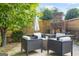 Relaxing outdoor patio with a brick fireplace and comfortable seating at 6510 Bentley Ridge Dr, Cumming, GA 30040