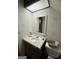 Bathroom featuring vanity with sink, mirror, toilet, and unique lighting fixture at 2606 Ramblewood Ct, Acworth, GA 30102