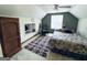 Spacious bedroom featuring carpet, window, closet, and overhead fan at 2606 Ramblewood Ct, Acworth, GA 30102