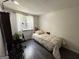 Cozy bedroom with wood floors, window, and natural light offering a peaceful retreat at 2606 Ramblewood Ct, Acworth, GA 30102