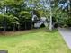 Charming single-story home with a lovely front yard and a covered carport at 2606 Ramblewood Ct, Acworth, GA 30102