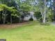 Charming single-story home with a lovely front yard and a covered carport at 2606 Ramblewood Ct, Acworth, GA 30102