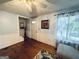 Inviting living room boasts hardwood floors, wainscoting, and ample natural light, creating a warm atmosphere at 2606 Ramblewood Ct, Acworth, GA 30102