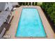 Aerial view of the large rectangular pool, deck, and surrounding fence at 1018 Nandina Ct, Villa Rica, GA 30180