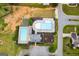 Aerial view of the community swimming pools, tennis court, and manicured landscaping at 1018 Nandina Ct, Villa Rica, GA 30180