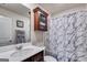 Bathroom with a vanity, sink, and shower featuring a marble-like curtain at 1018 Nandina Ct, Villa Rica, GA 30180