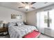 Bright bedroom with plush carpet, ceiling fan, natural light and neutral paint at 1018 Nandina Ct, Villa Rica, GA 30180